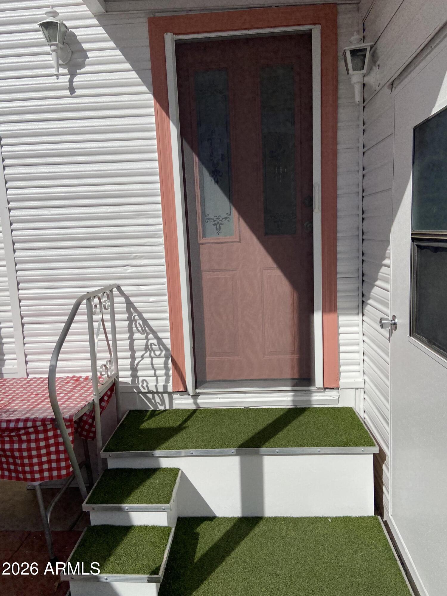 1336 West Inuit Avenue, Unit 336 Apache Junction, AZ 85119 - Photo 24 of 35 a view of house with a yard