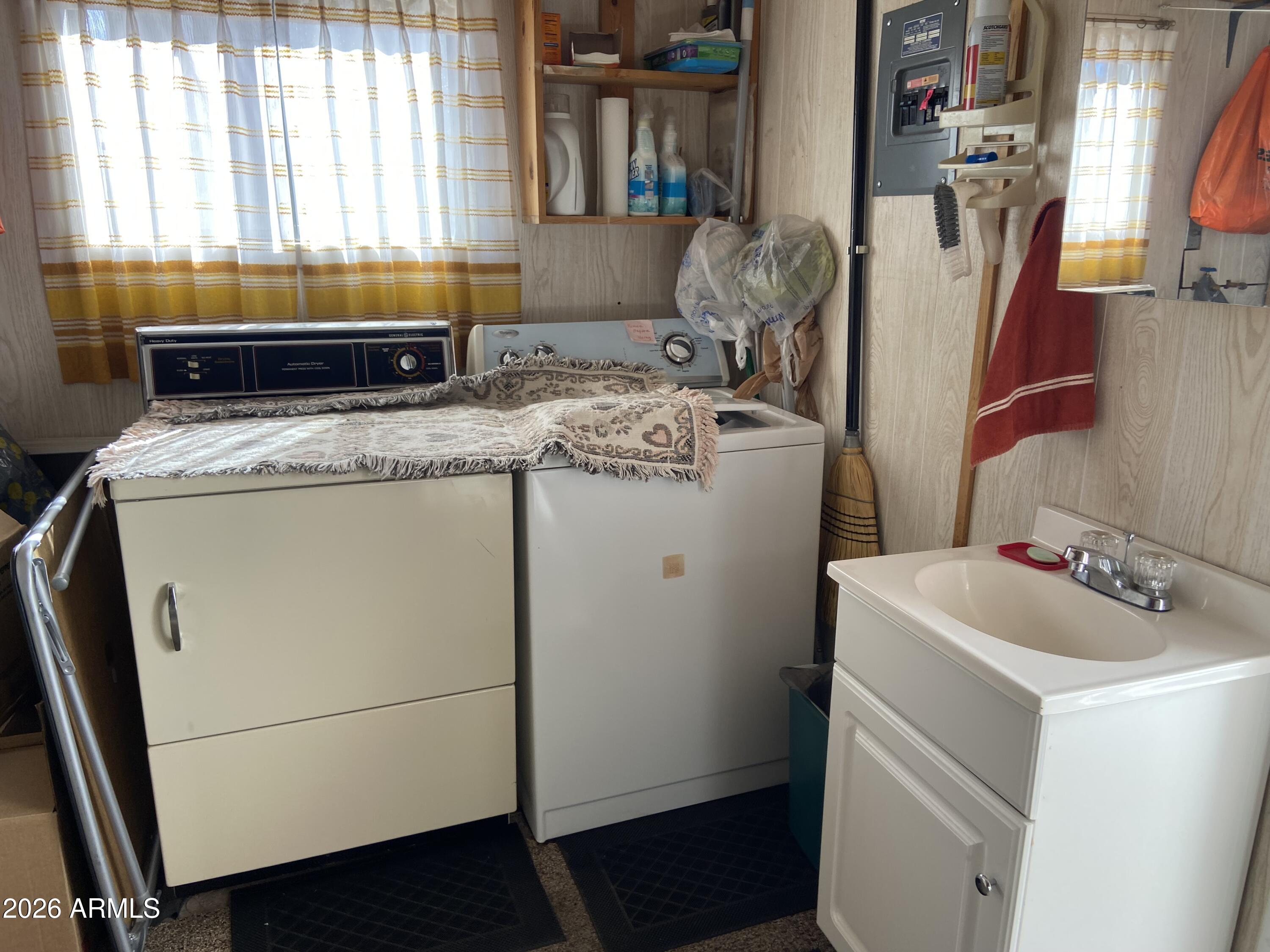 1336 West Inuit Avenue, Unit 336 Apache Junction, AZ 85119 - Photo 27 of 35 a utility room with dryer and washer