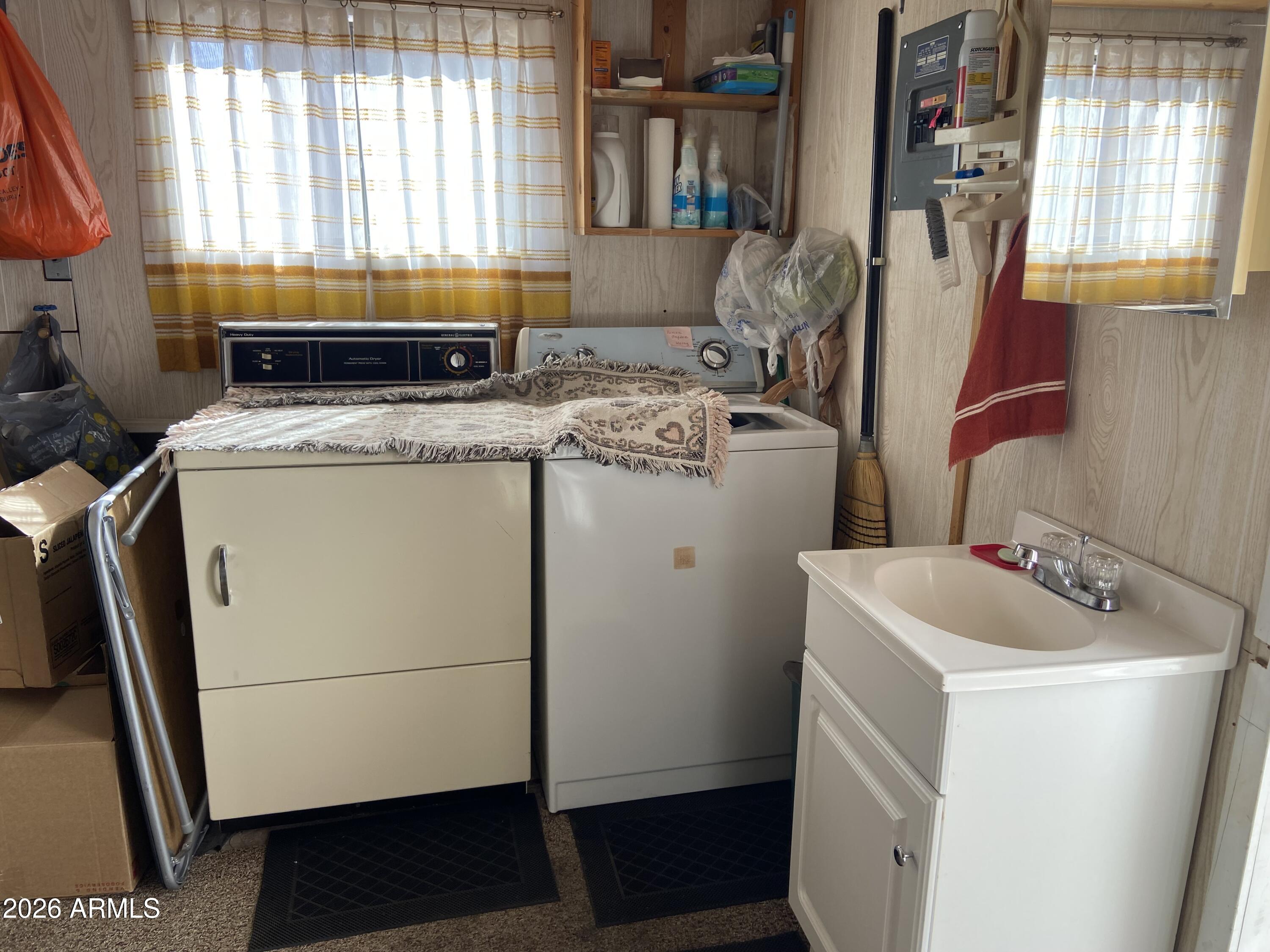 1336 West Inuit Avenue, Unit 336 Apache Junction, AZ 85119 - Photo 28 of 35 a utility room with dryer and washer