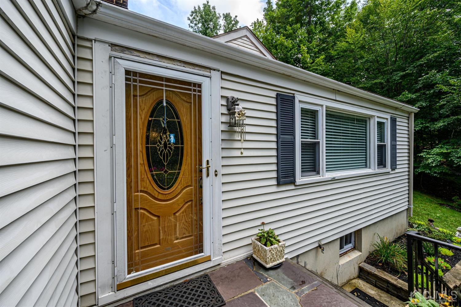 10 Stiles Road Warren, NJ 07059 - Photo 2 of 39 a front view of a house with a garden