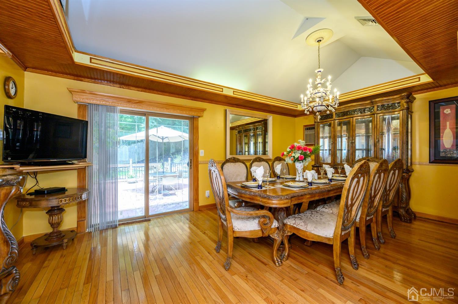 10 Stiles Road Warren, NJ 07059 - Photo 12 of 39 a view of a dining room with furniture wooden floor and chandelier