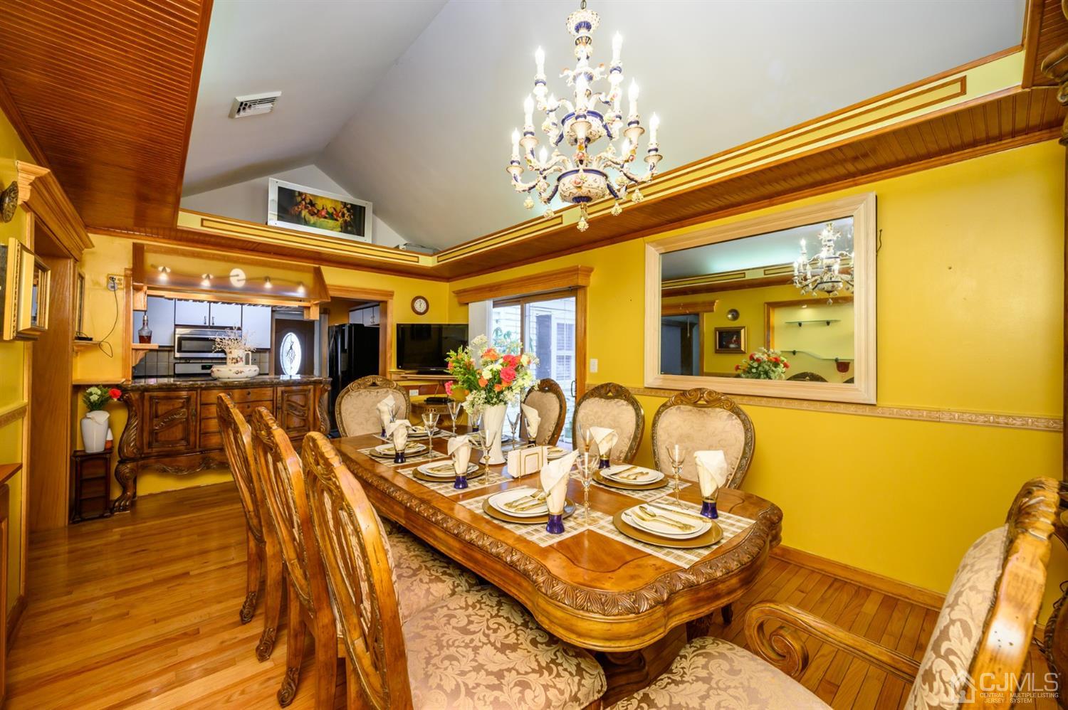 10 Stiles Road Warren, NJ 07059 - Photo 13 of 39 a view of a dining room with furniture and chandelier