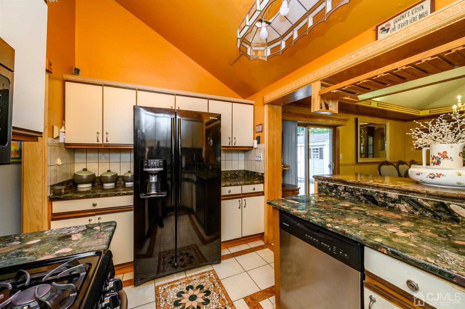10 Stiles Road Warren, NJ 07059 - Photo 17 of 39 a kitchen with stainless steel appliances granite countertop a stove refrigerator and cabinets