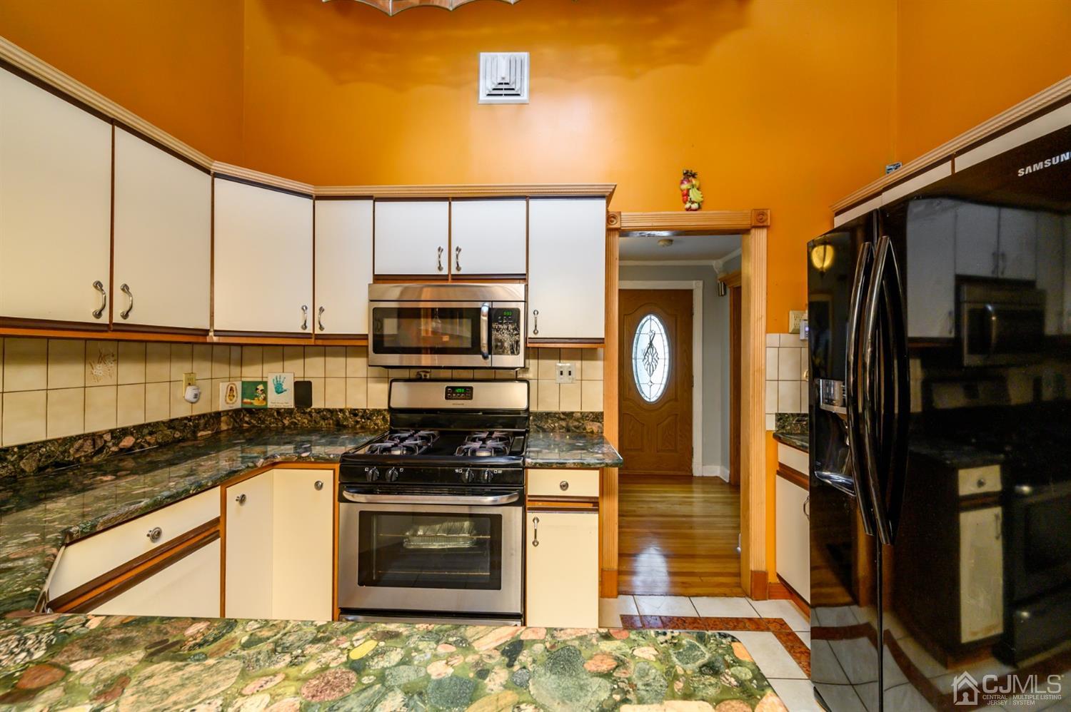 10 Stiles Road Warren, NJ 07059 - Photo 19 of 39 a kitchen with stainless steel appliances granite countertop a stove a sink and a refrigerator