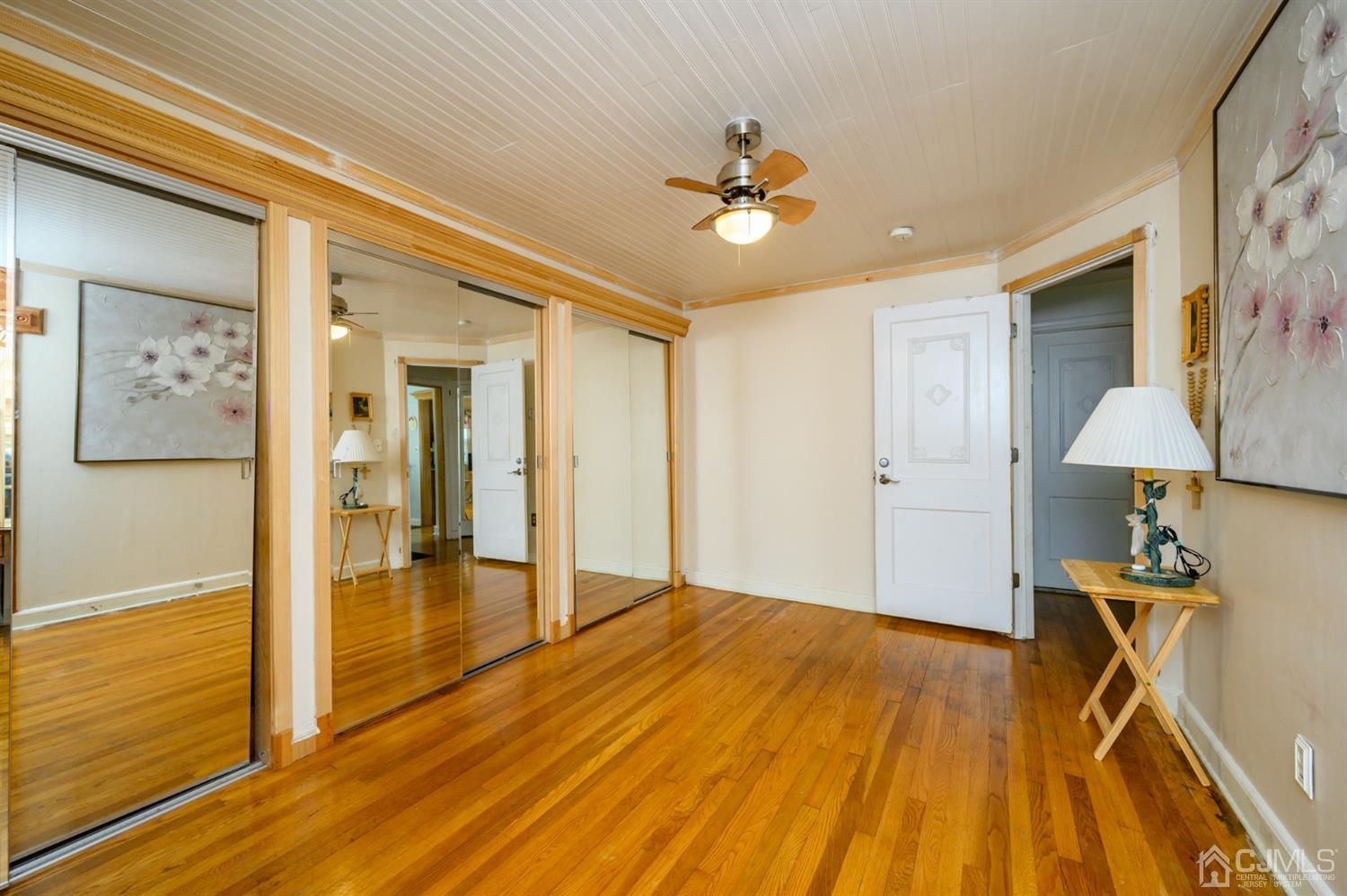 10 Stiles Road Warren, NJ 07059 - Photo 22 of 39 a view of a livingroom with wooden floor and a ceiling fan