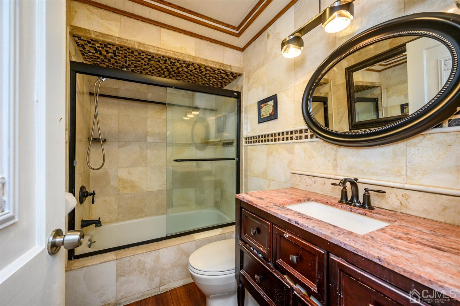 10 Stiles Road Warren, NJ 07059 - Photo 25 of 39 a bathroom with a granite countertop toilet sink and mirror