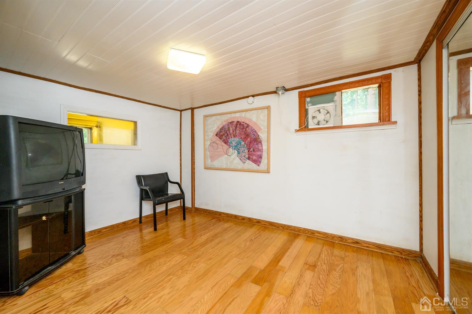 10 Stiles Road Warren, NJ 07059 - Photo 27 of 39 a view of a livingroom with furniture and wooden floor