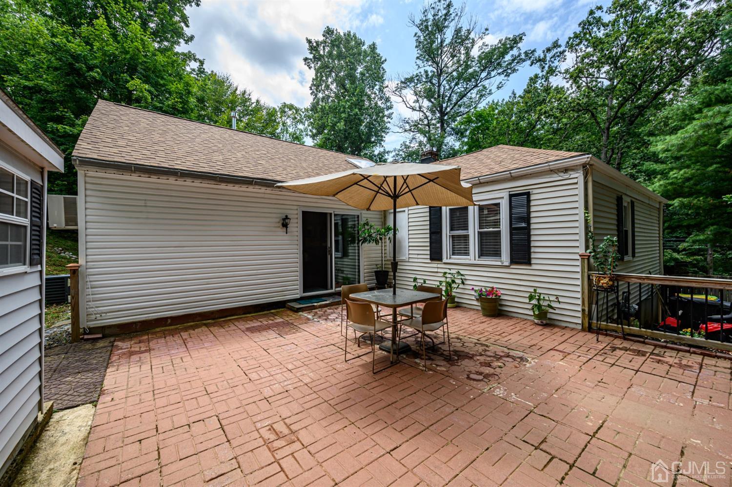 10 Stiles Road Warren, NJ 07059 - Photo 32 of 39 a backyard of a house with seating space