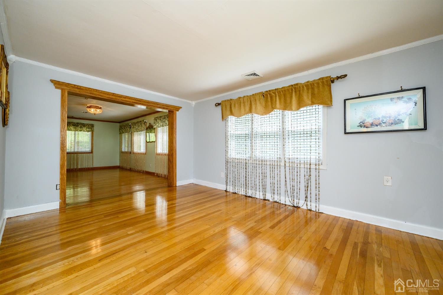10 Stiles Road Warren, NJ 07059 - Photo 7 of 39 a view of empty room with wooden floor and fan