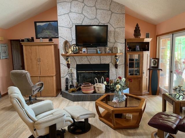 6325 Salado Road St. Augustine, FL 32080 - Photo 13 of 28 a living room with furniture a flat screen tv and a fireplace