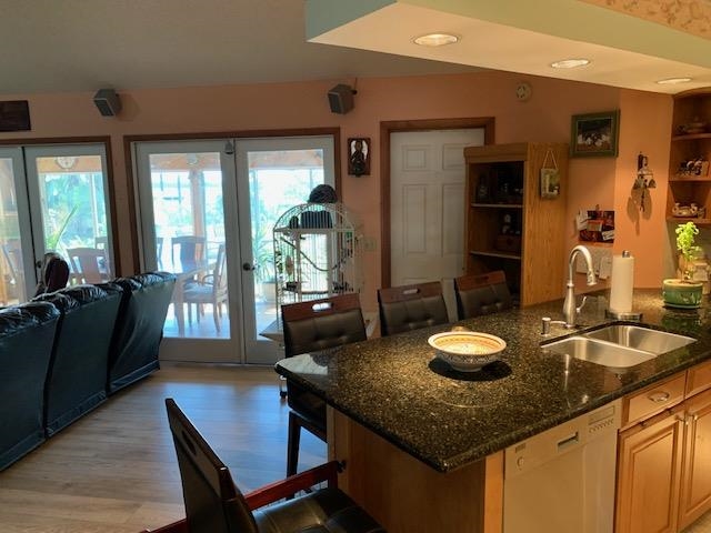 6325 Salado Road St. Augustine, FL 32080 - Photo 16 of 28 a kitchen with a granite countertop sink and cabinets