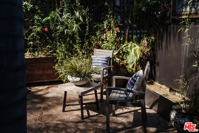 a view of a street with house in the background