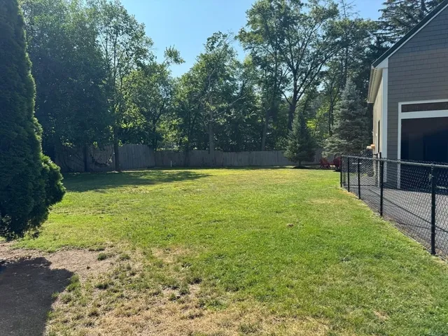 a swimming pool with wooden fence
