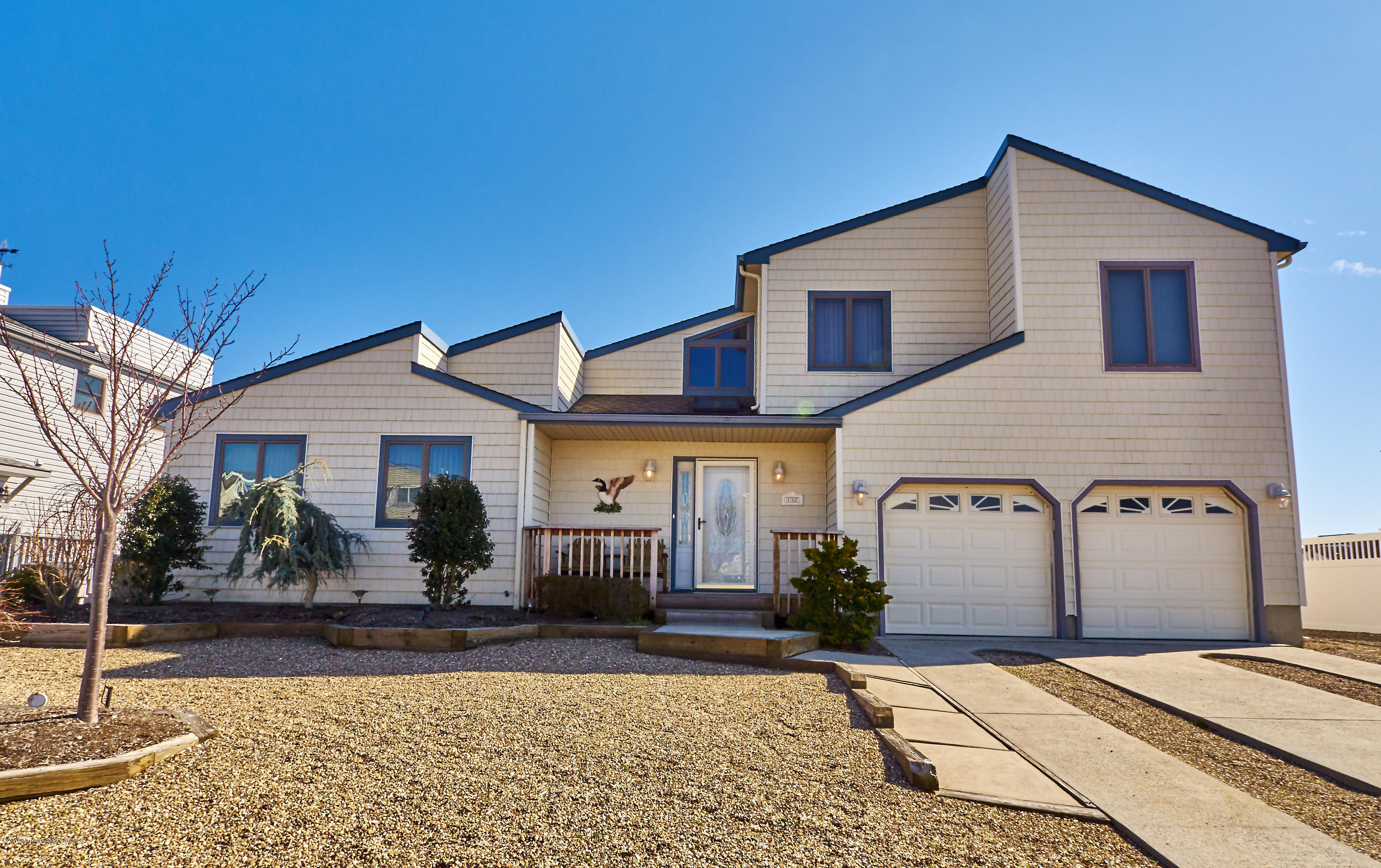 132 Peter Road Manahawkin, NJ 08050 - Photo 1 of 36 a front view of a house with garden