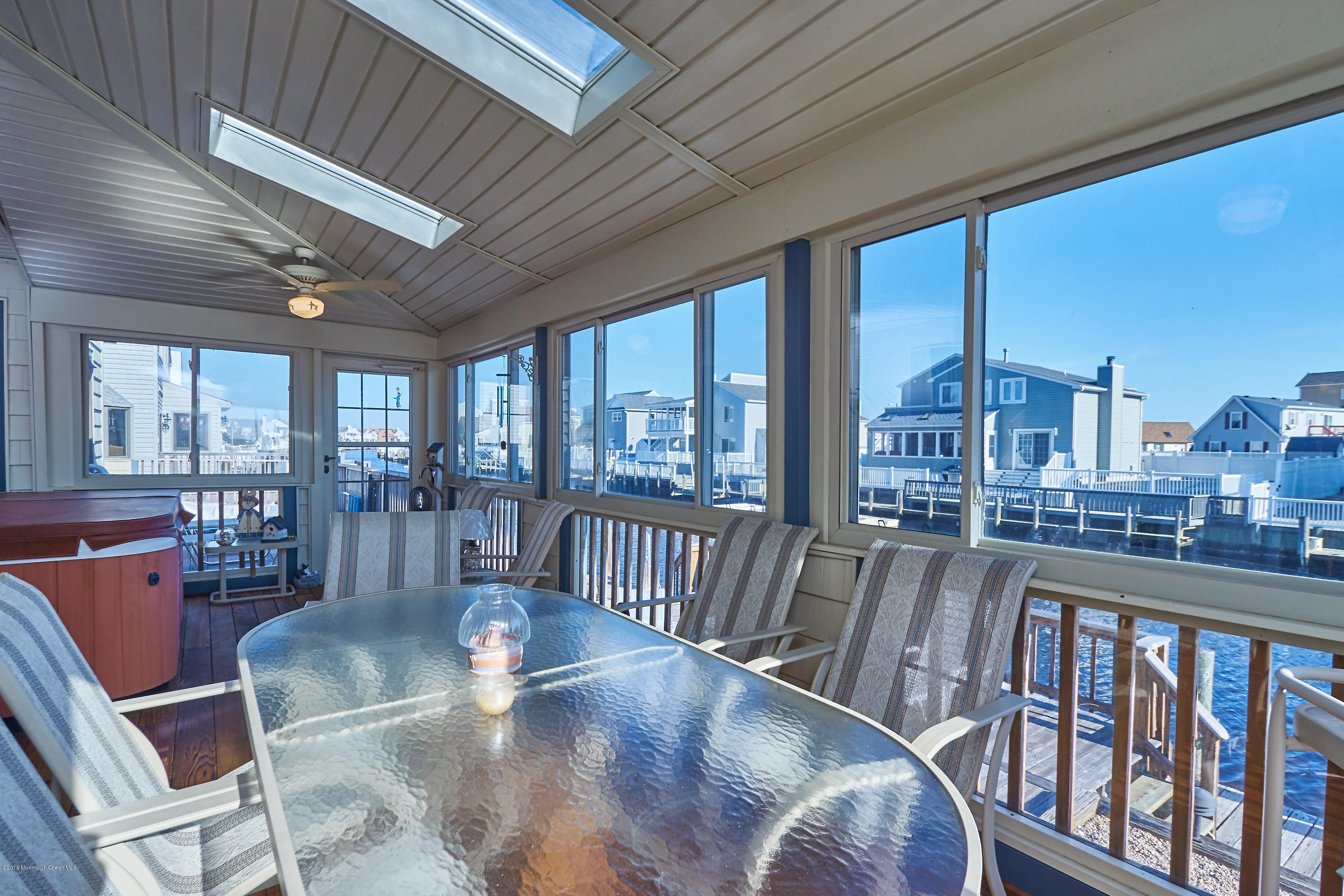132 Peter Road Manahawkin, NJ 08050 - Photo 13 of 36 a view of a dining room with furniture window and wooden floor