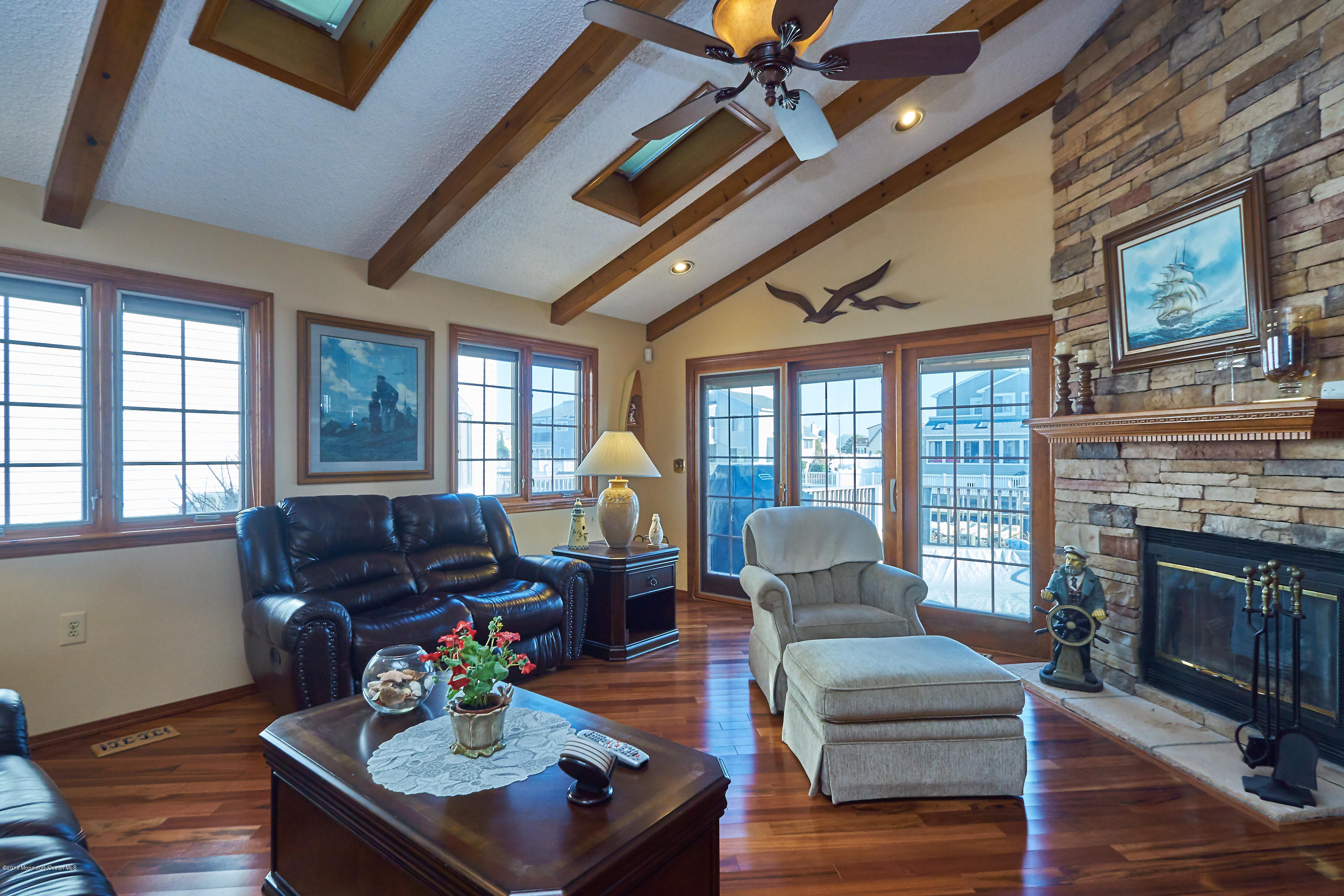 132 Peter Road Manahawkin, NJ 08050 - Photo 17 of 36 a living room with furniture fireplace and a large window