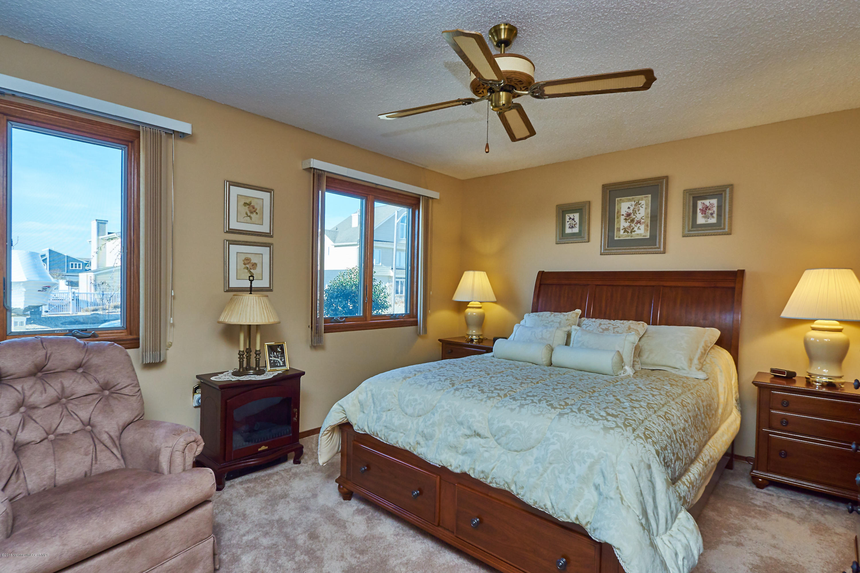 132 Peter Road Manahawkin, NJ 08050 - Photo 20 of 36 a bedroom with a large bed and windows