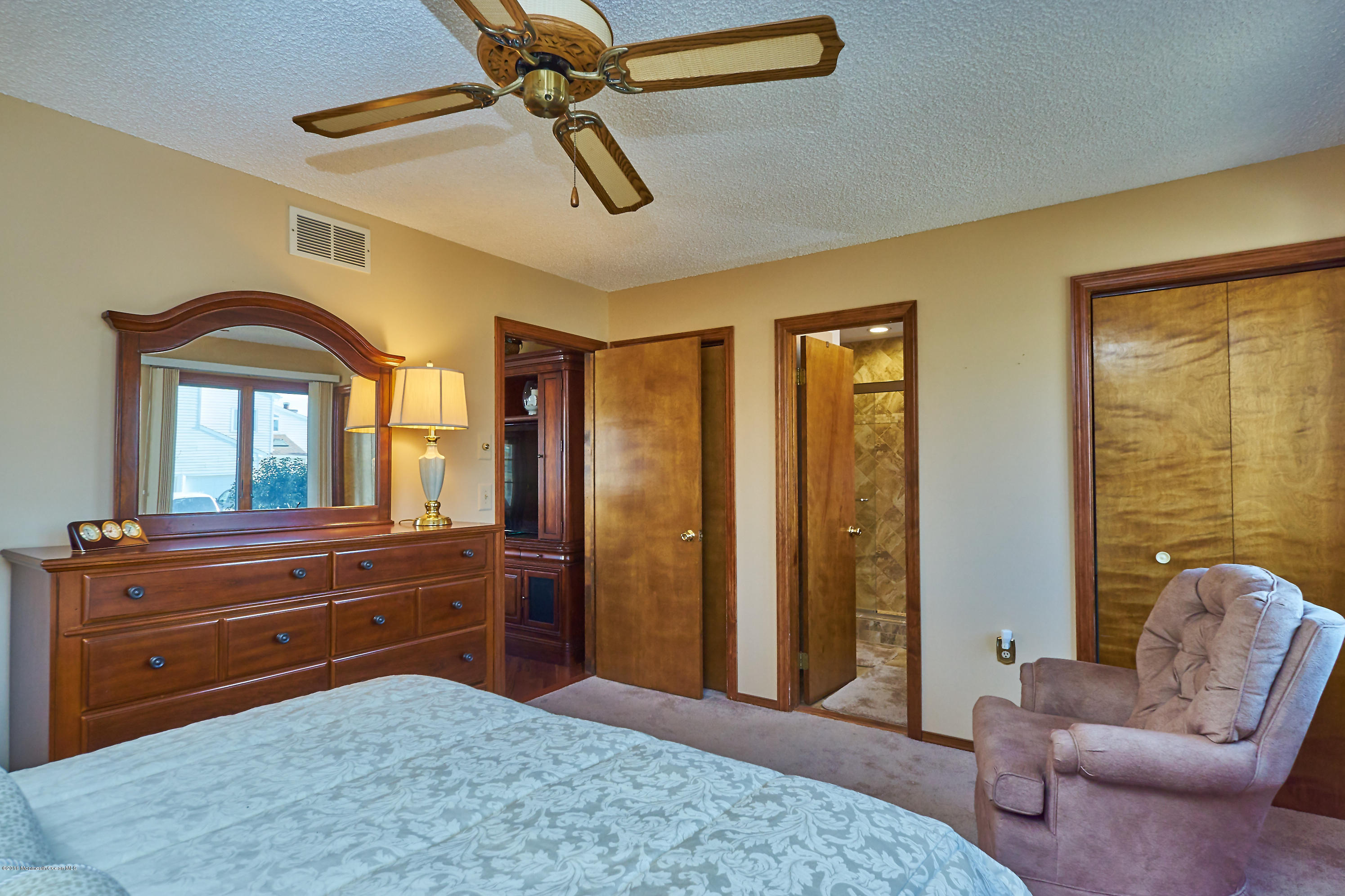 132 Peter Road Manahawkin, NJ 08050 - Photo 21 of 36 a spacious bedroom with a bed and a dresser