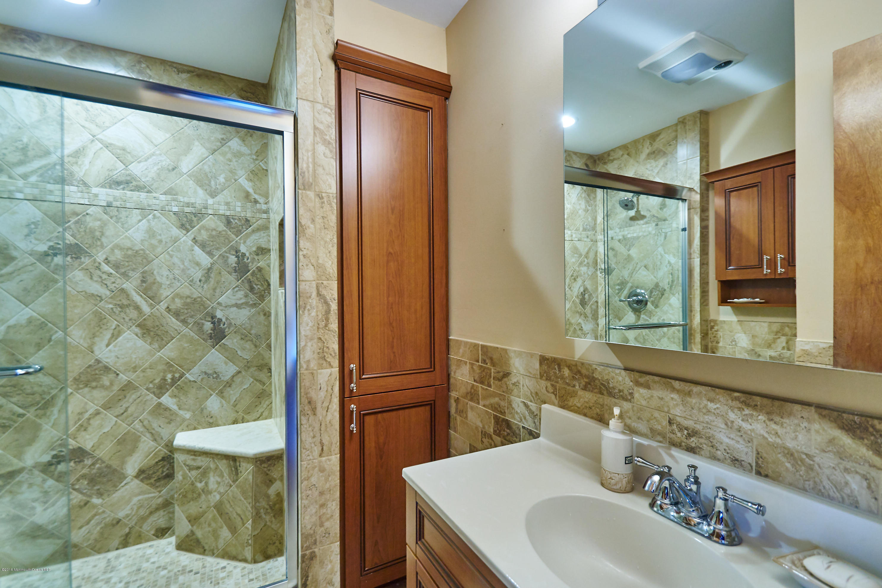 132 Peter Road Manahawkin, NJ 08050 - Photo 22 of 36 a bathroom with a sink and a mirror