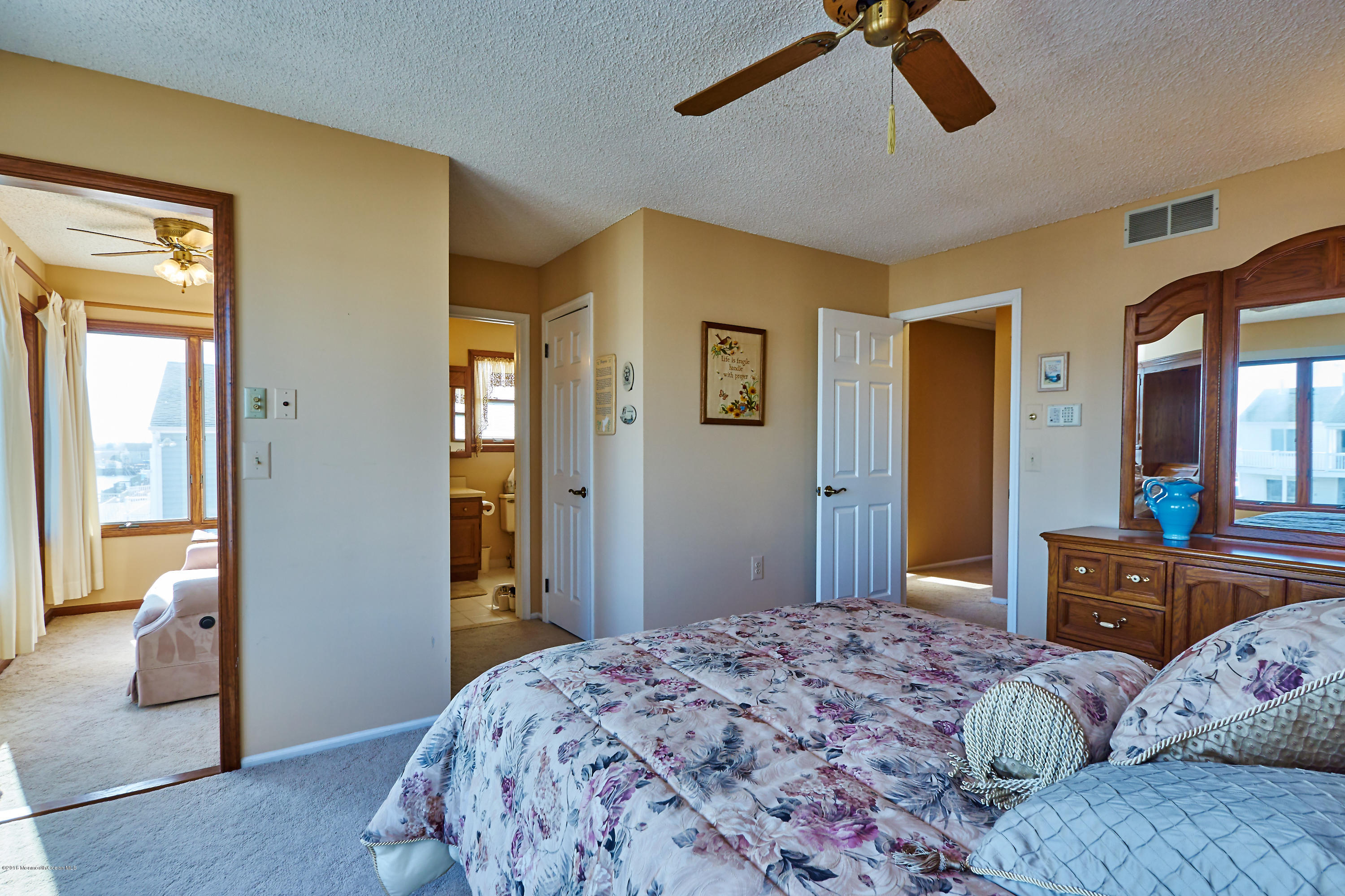 132 Peter Road Manahawkin, NJ 08050 - Photo 27 of 36 a bedroom with a bed and wooden floor