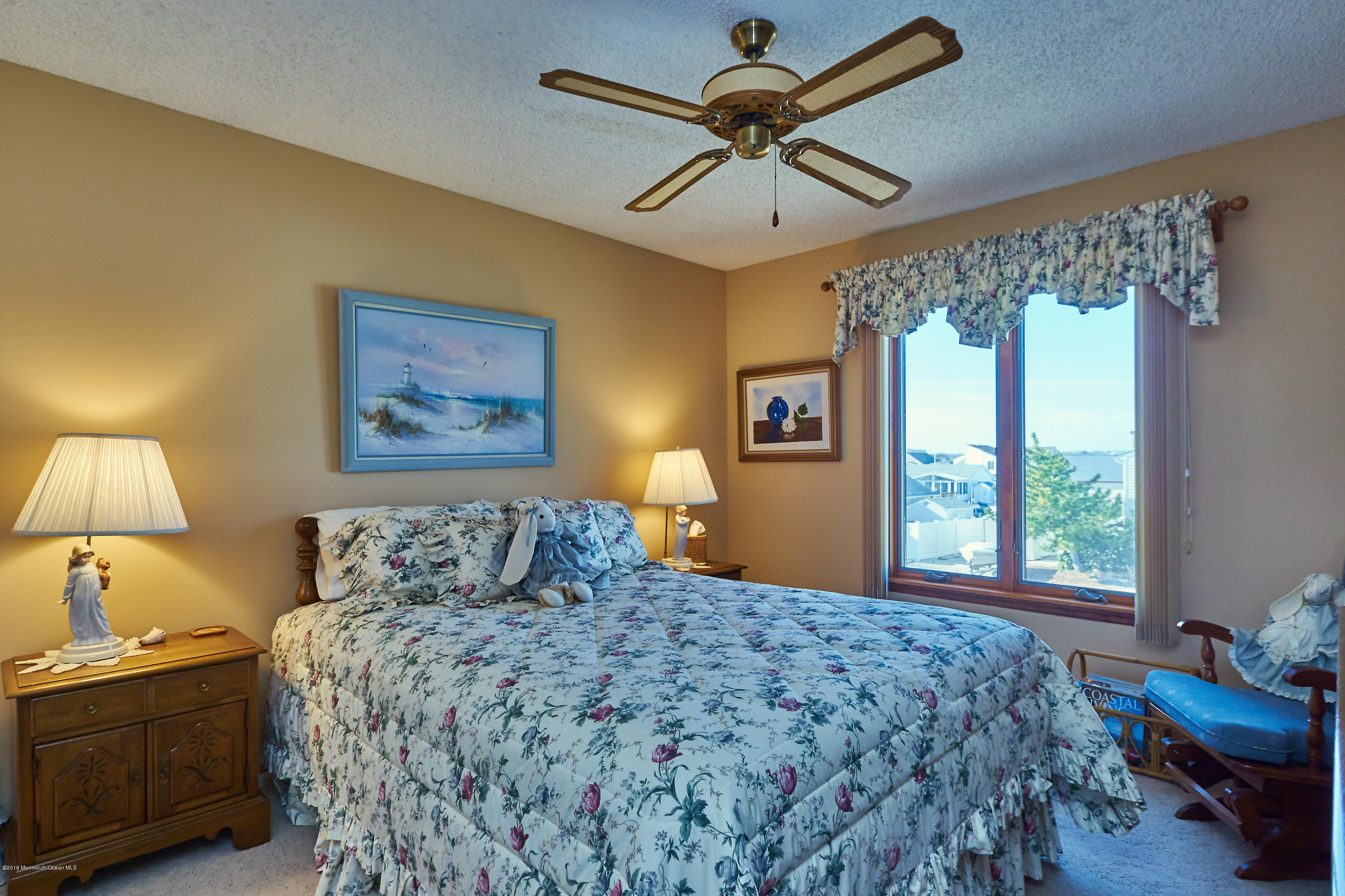 132 Peter Road Manahawkin, NJ 08050 - Photo 30 of 36 a bedroom with a bed and a chandelier