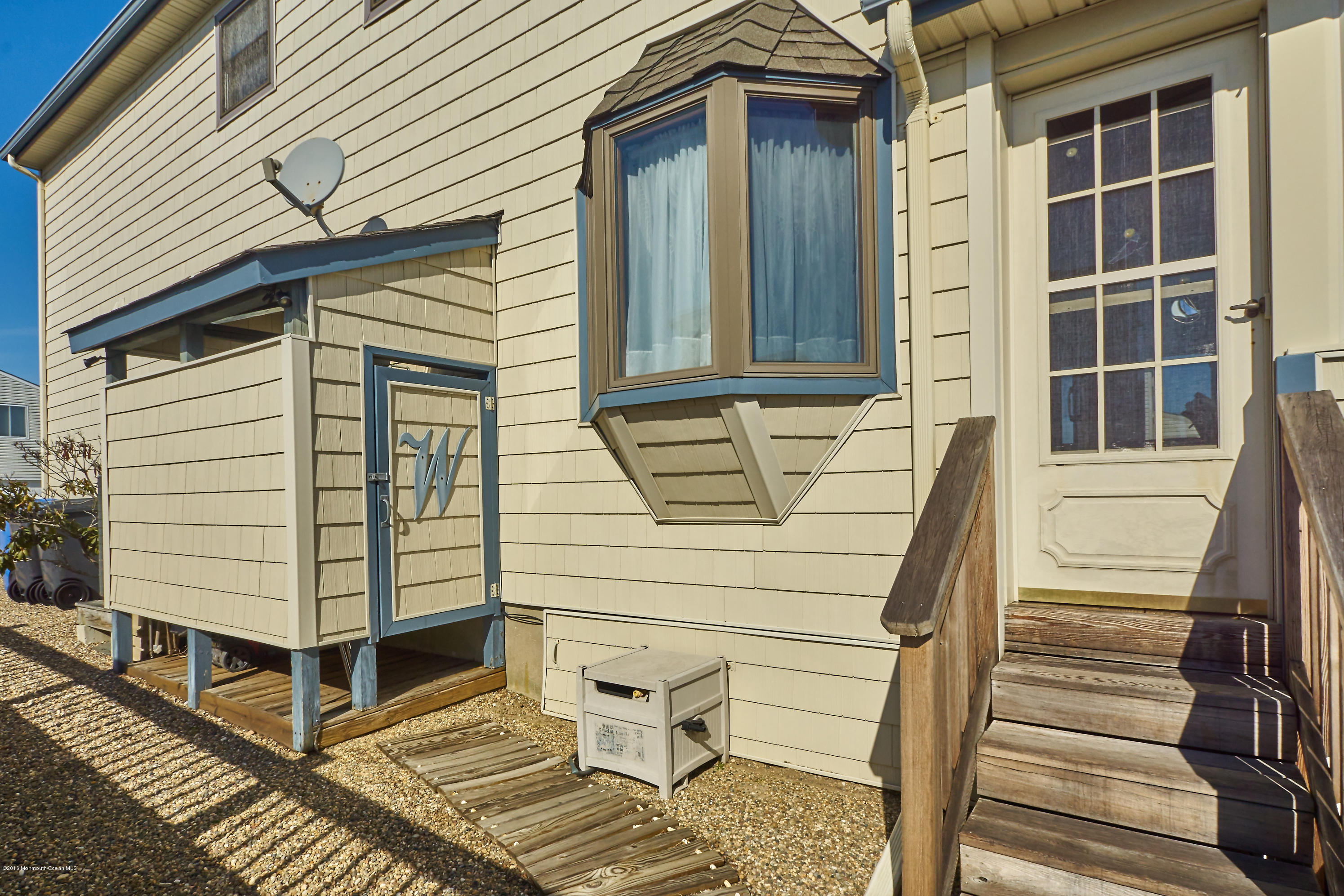 132 Peter Road Manahawkin, NJ 08050 - Photo 36 of 36 a view of a house with a door and wooden floor