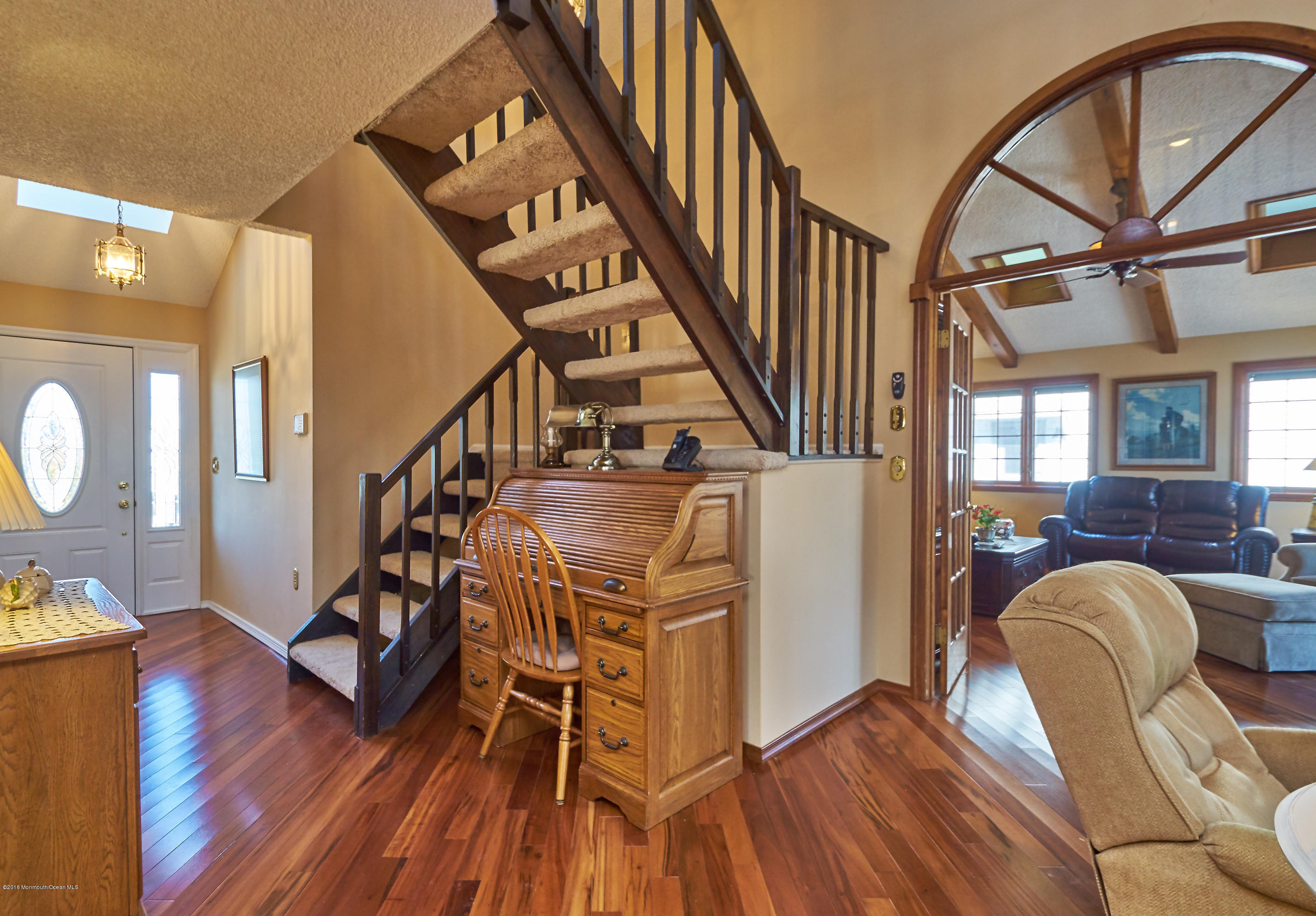 132 Peter Road Manahawkin, NJ 08050 - Photo 4 of 36 a living room with couches and dining table with wooden floor