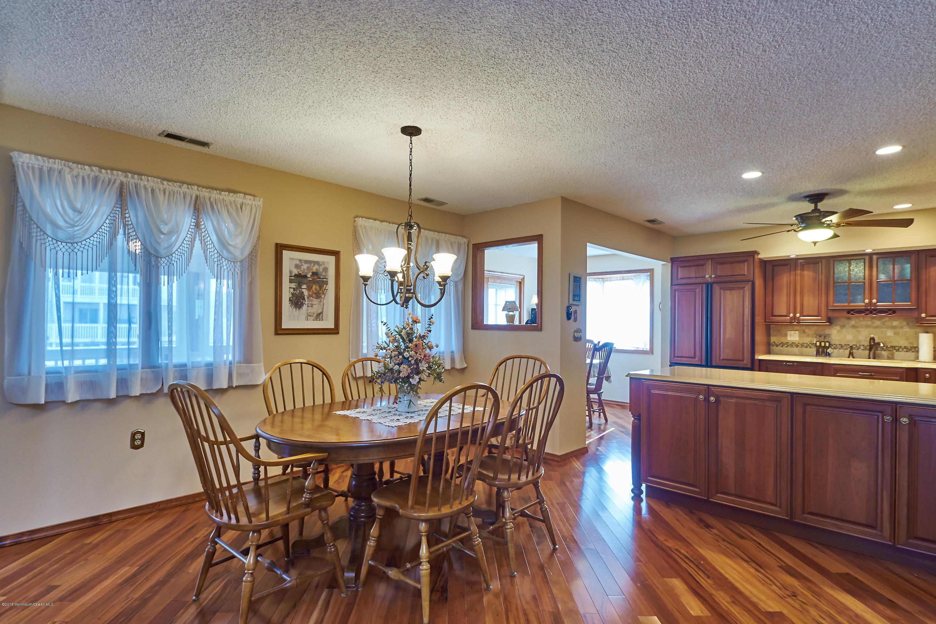 132 Peter Road Manahawkin, NJ 08050 - Photo 7 of 36 a view of a dining room with furniture window and wooden floor