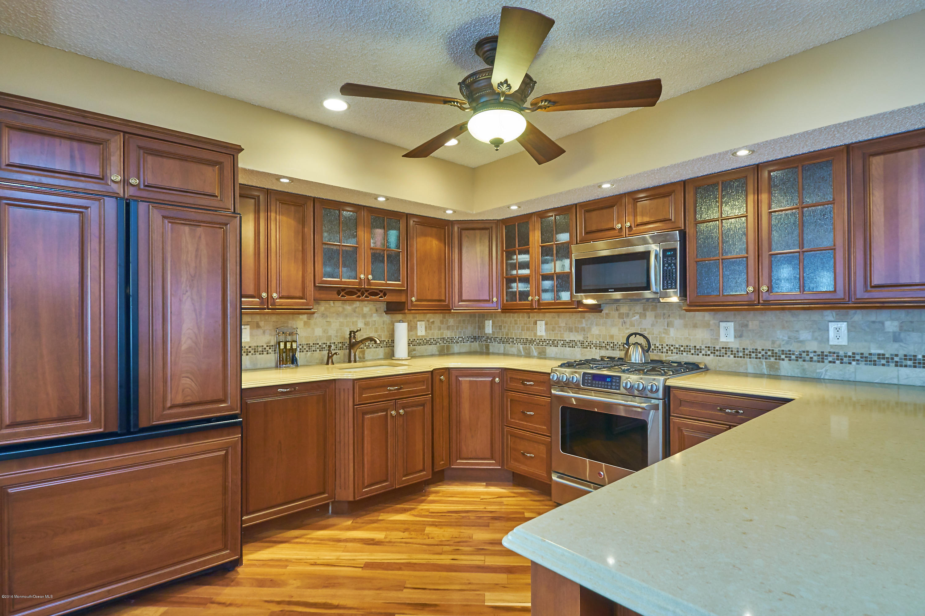 132 Peter Road Manahawkin, NJ 08050 - Photo 8 of 36 a kitchen with stainless steel appliances granite countertop a sink and cabinets