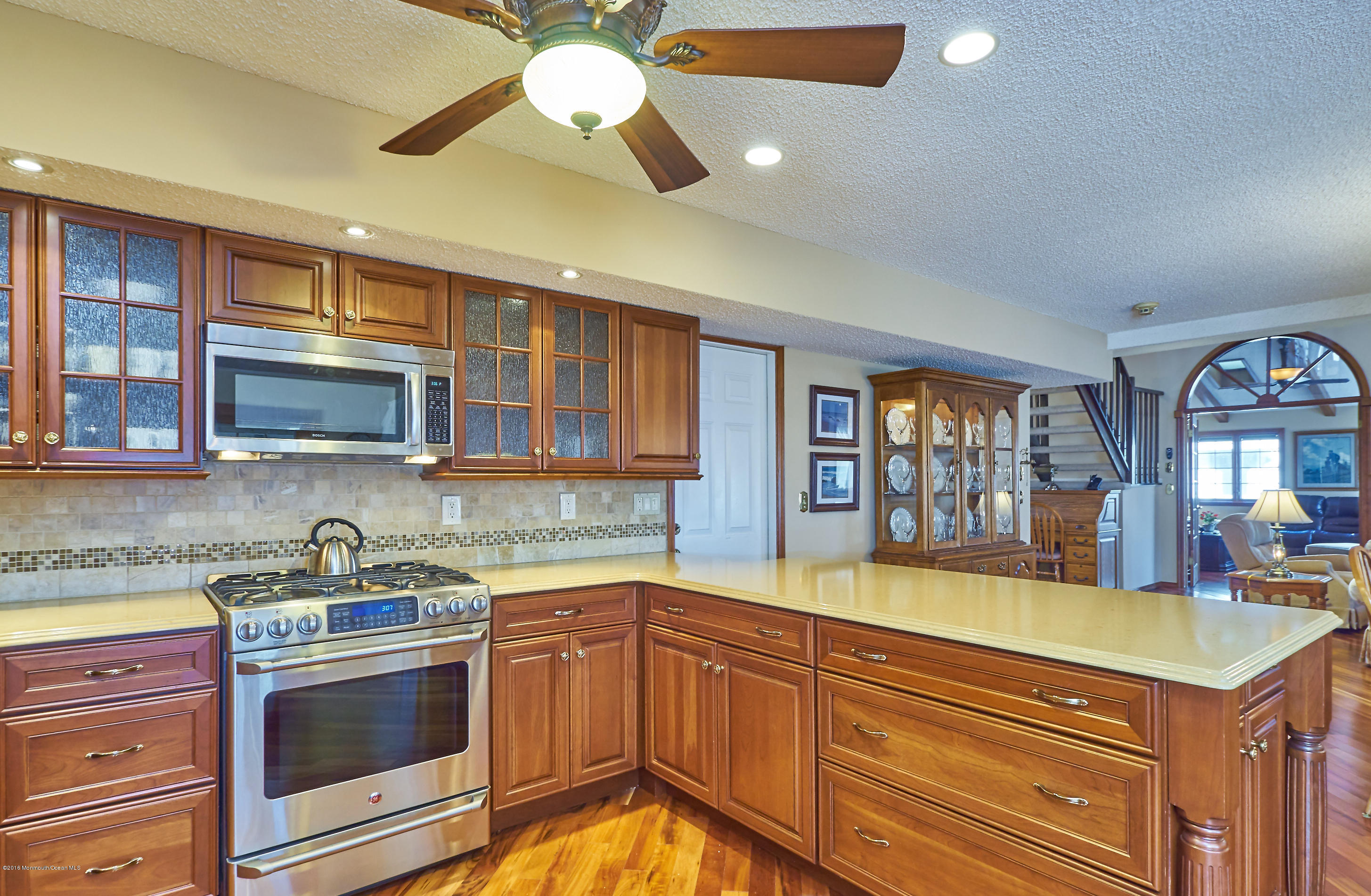 132 Peter Road Manahawkin, NJ 08050 - Photo 9 of 36 a kitchen with stainless steel appliances granite countertop a sink and cabinets