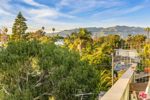 a terrace with outdoor seating and wooden floor