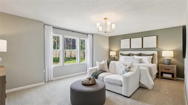 a bed room with furniture and a chandelier