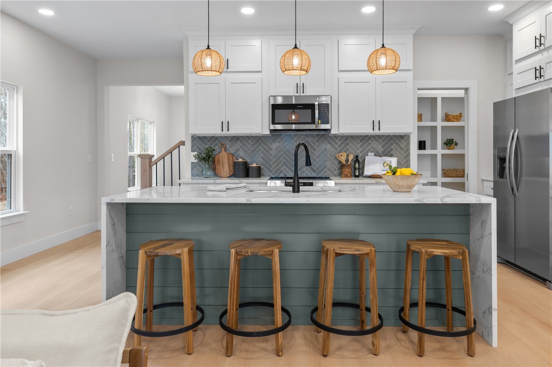 502 Point Road Westminster, SC 29693 - Photo 9 of 45 This kitchen showcases a central island, modern appliances, and a beautiful backsplash.