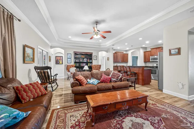 a kitchen with granite countertop a sink stove and cabinets