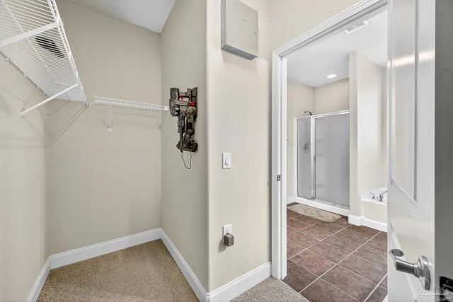 a bathroom with a tub shower vanity and sink