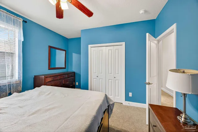 a room with painting and a lamp