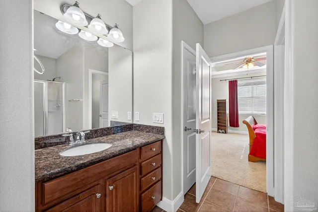 a bedroom with a large bed and a flat screen tv