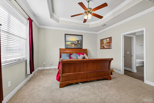 a reading room with furniture and a large window