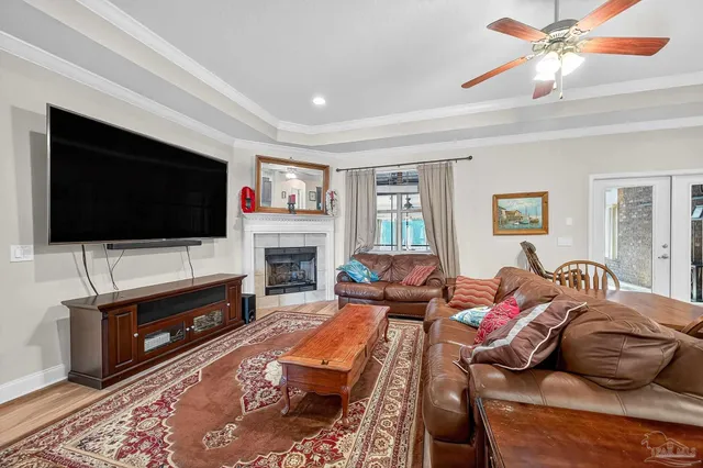a living room with fireplace furniture and a flat screen tv