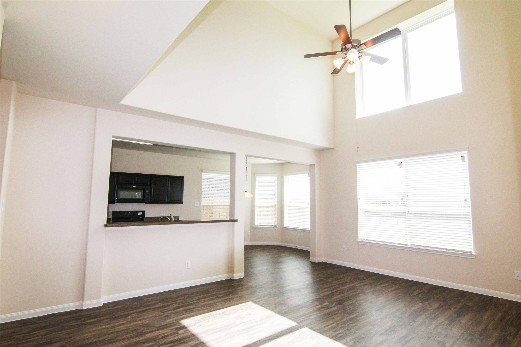 29622 Clover Shore Drive Spring, TX 77386 - Photo 12 of 20 a view of a livingroom with wooden floor and a ceiling fan
