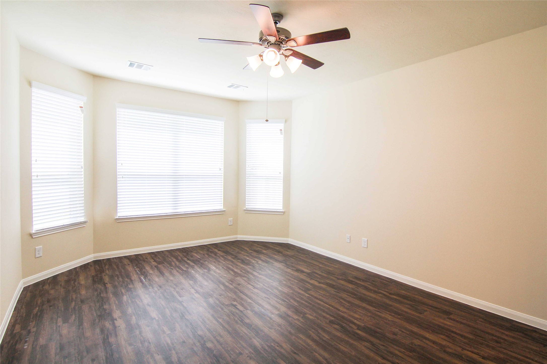 29622 Clover Shore Drive Spring, TX 77386 - Photo 5 of 20 wooden floor in an empty room with a window