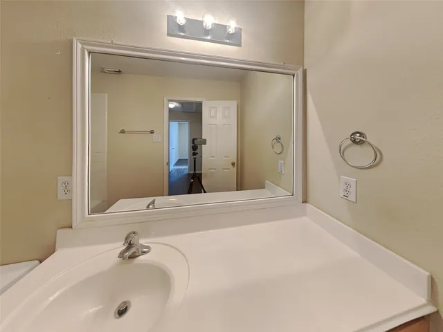 a bathroom with a tub and sink