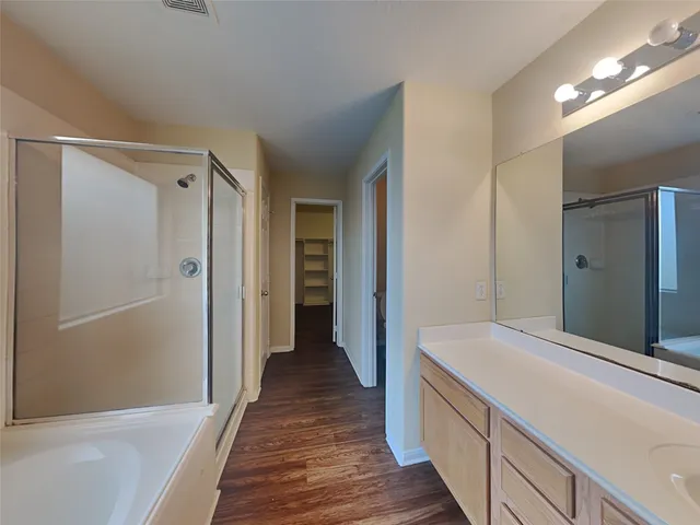 a bathroom with a sink and a large mirror