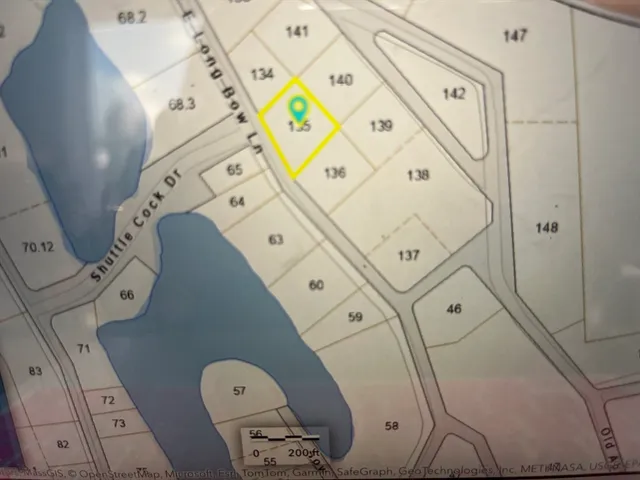 a floor with white walls and a painting on the wall