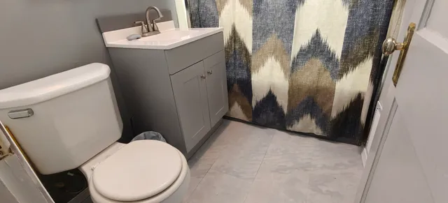 a bathroom with a toilet and a sink