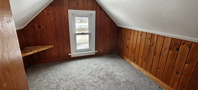 a view of a house with large trees
