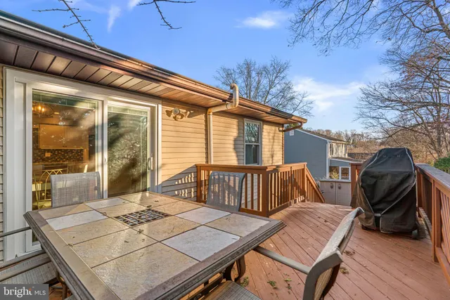 a view of a patio with a table and chairs