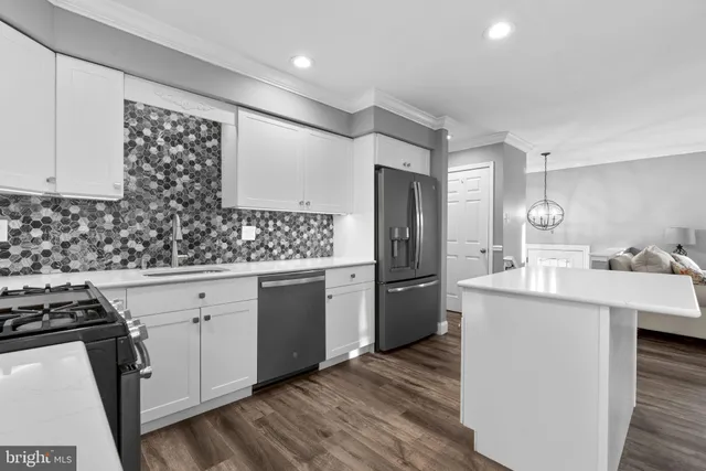 a kitchen with a sink stove and refrigerator