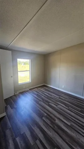 a view of balcony and wooden floor