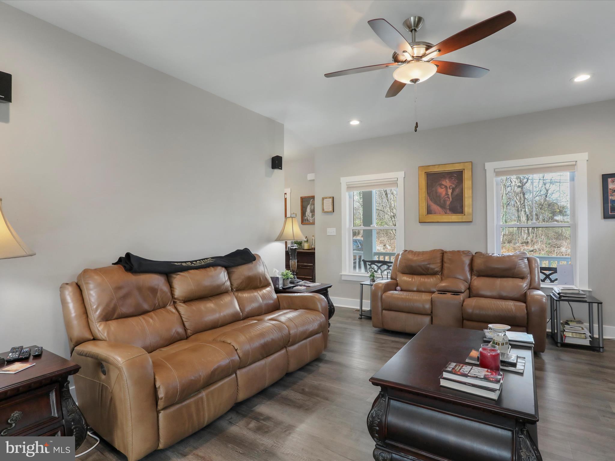 1150 Lewisville Road Berryville, VA 22611 - Photo 34 of 50 a living room with furniture ceiling fan and a window